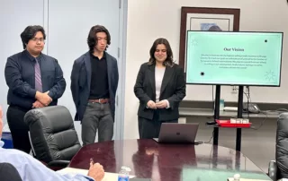 three-high-school-students-giving-a-presentation