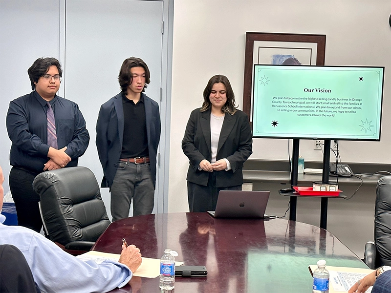 three-high-school-students-giving-a-presentation